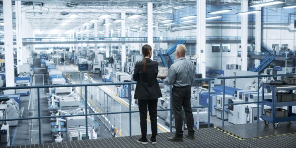 Middle,Aged,Engineer,And,Female,Scientist,Standing,With,Their,Back,